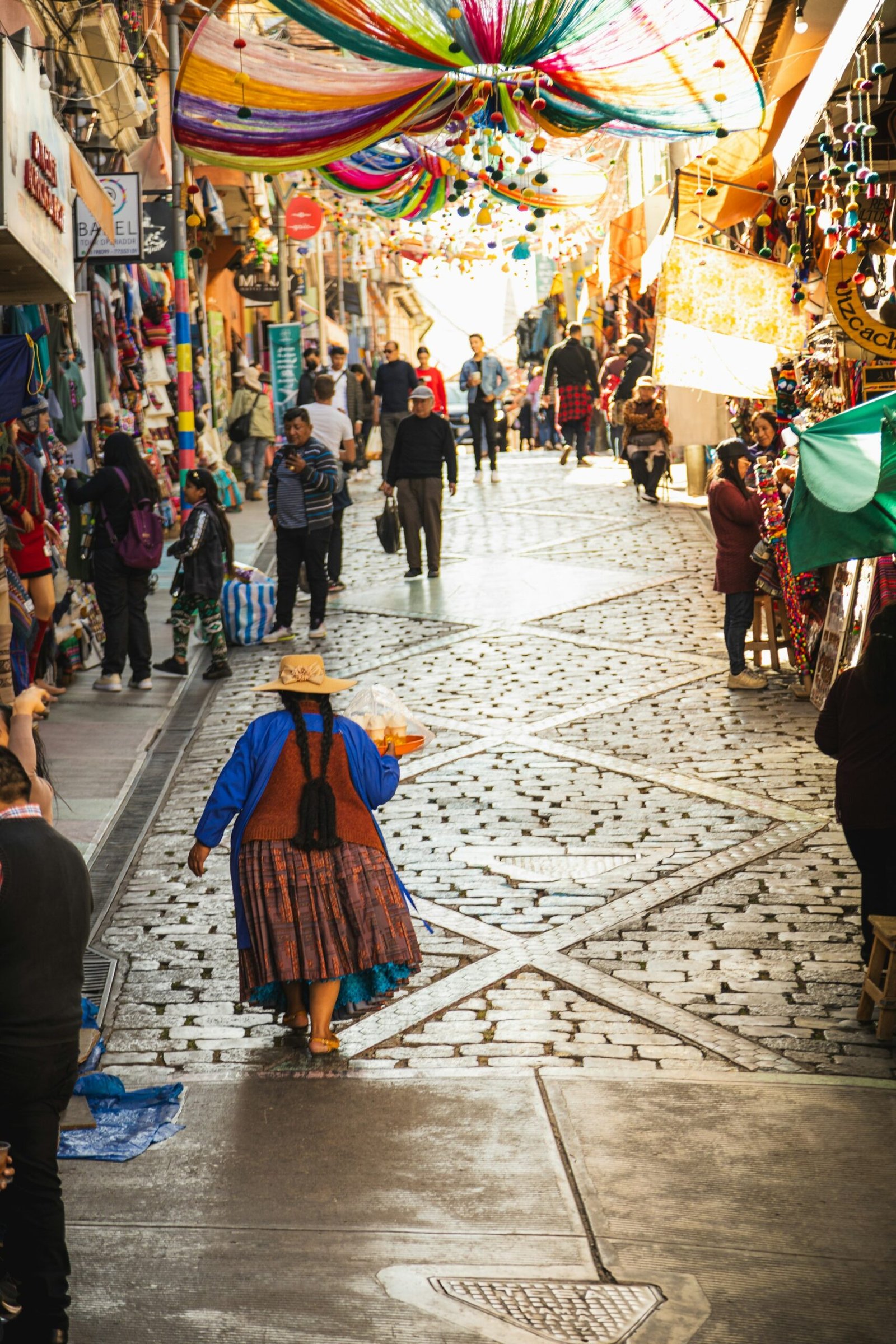 A vibrant street scene in la paz showcases its bustling markets and the city's unique blend of tradition and modernity.